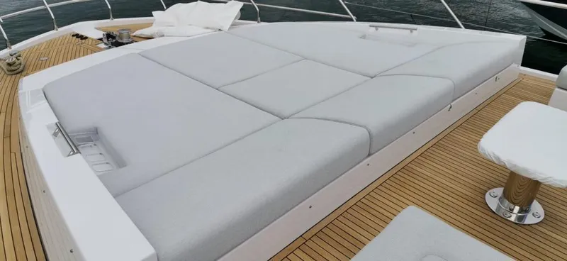 Goldinia Yacht Photos Pics Luxurious sunbed on 2021 Azimut 72 yacht deck with teak flooring.