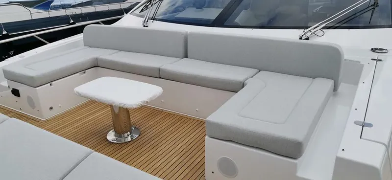 Goldinia Yacht Photos Pics Luxurious seating area on 2021 Azimut 72 yacht with sleek design and wooden deck.