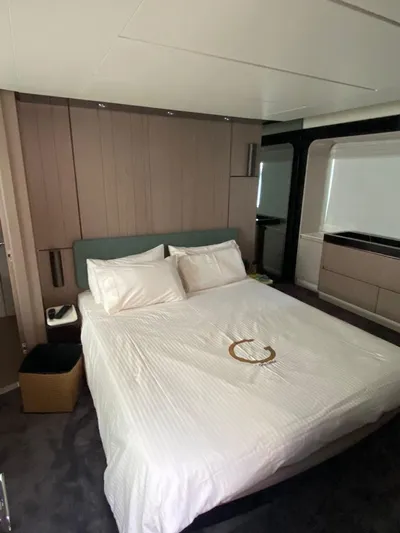 Goldinia Yacht Photos Pics Luxurious bedroom interior of 2021 Azimut 72 yacht with modern design and comfortable bedding.