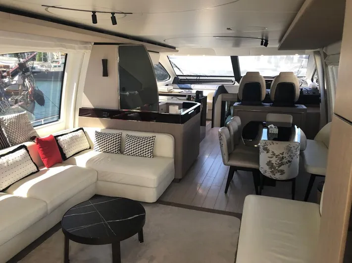 Goldinia Yacht Photos Pics Luxurious interior of a 2021 Azimut 72 yacht with elegant seating and dining area.