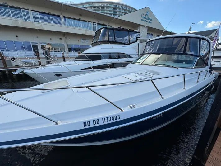  Yacht Photos Pics 2004 Formula 40 PC yacht docked at marina, sleek design, clear skies.