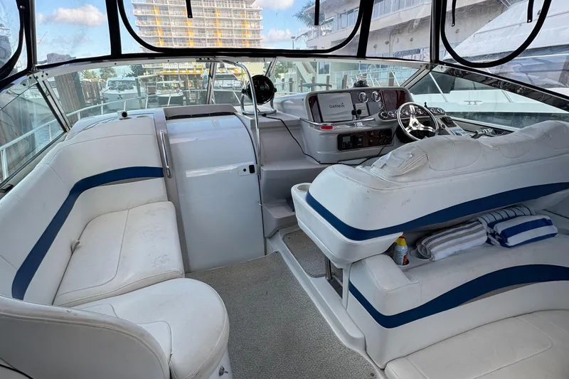  Yacht Photos Pics 2004 Formula 40 PC yacht interior with white seating and modern dashboard.