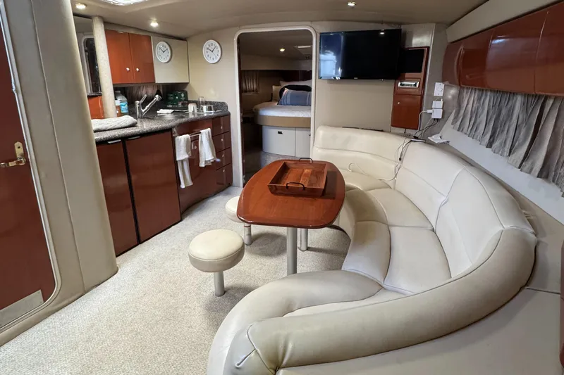 Yacht Photos Pics Luxurious 2004 Formula 40 PC yacht interior with kitchen, seating, and bedroom.
