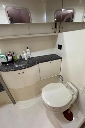  Yacht Photos Pics 2004 Formula 40 PC yacht bathroom with sink, toilet, and storage cabinets.