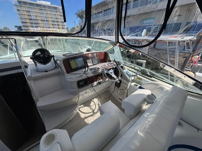  Yacht Photos Pics 2004 Formula 40 PC yacht cockpit with modern navigation equipment and comfortable seating.