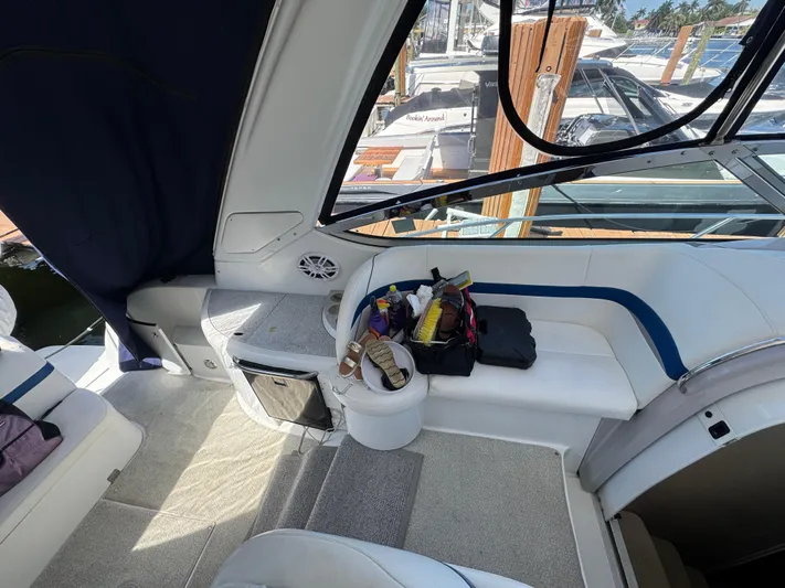  Yacht Photos Pics 2004 Formula 40 PC boat interior with seating and storage, docked at marina.