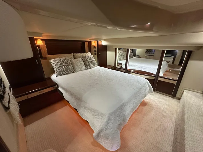  Yacht Photos Pics Luxurious bedroom interior of 2006 Sea Ray 58 Sedan Bridge yacht with elegant bedding.
