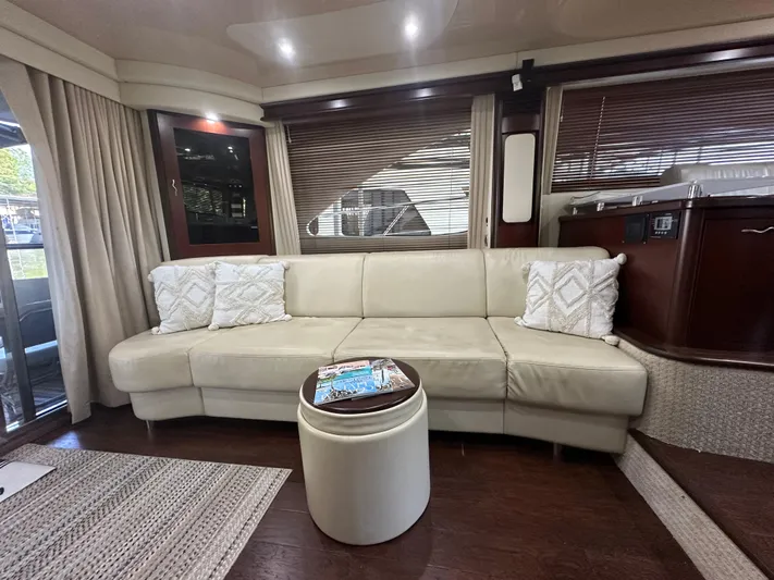 Yacht Photos Pics Luxurious interior of 2006 Sea Ray 58 Sedan Bridge yacht with cream leather sofa.