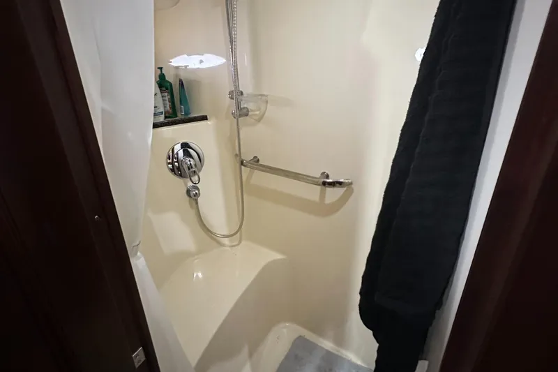  Yacht Photos Pics Shower area in 2006 Sea Ray 58 Sedan Bridge yacht, featuring modern fixtures and storage.