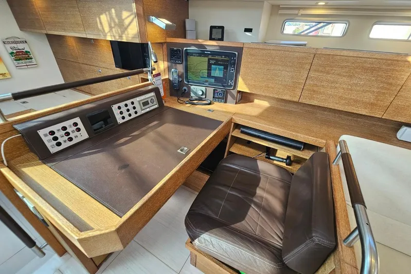 Cnb 60 Yacht Photos Pics Luxurious 2013 CNB BORDEAUX 60 yacht interior with navigation station and leather chair.