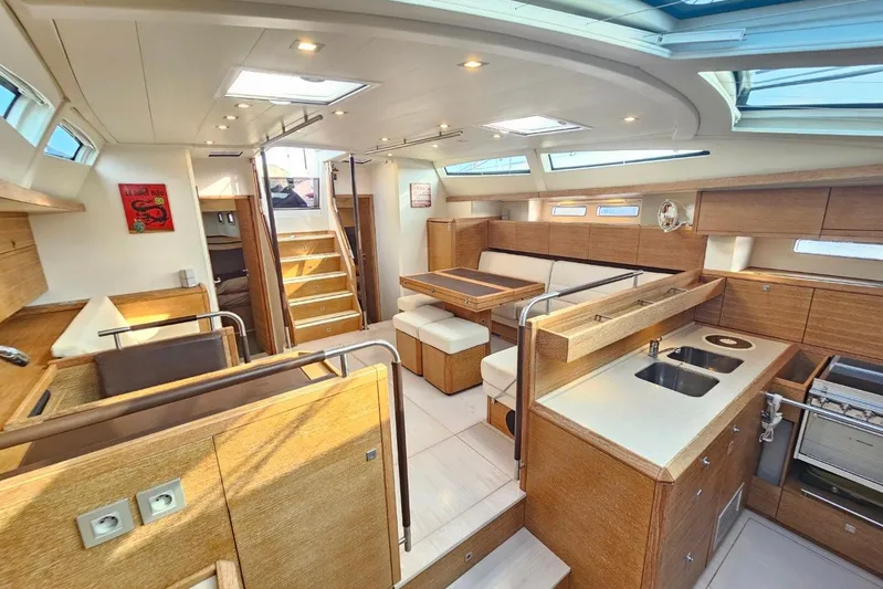 Cnb 60 Yacht Photos Pics Luxurious interior of 2013 CNB BORDEAUX 60 yacht with modern kitchen and seating area.