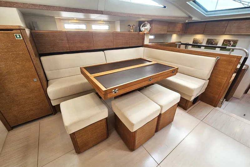 Cnb 60 Yacht Photos Pics Luxurious interior of 2013 CNB BORDEAUX 60 yacht with elegant seating and wooden accents.