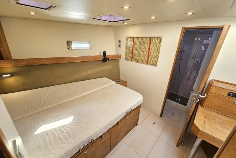 Cnb 60 Yacht Photos Pics Luxurious bedroom interior of 2013 CNB BORDEAUX 60 yacht with ensuite bathroom.