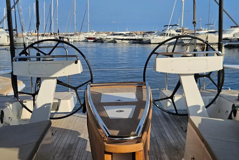 Cnb 60 Yacht Photos Pics Luxury yacht CNB BORDEAUX 60, 2013 model, docked in a marina with dual steering wheels.