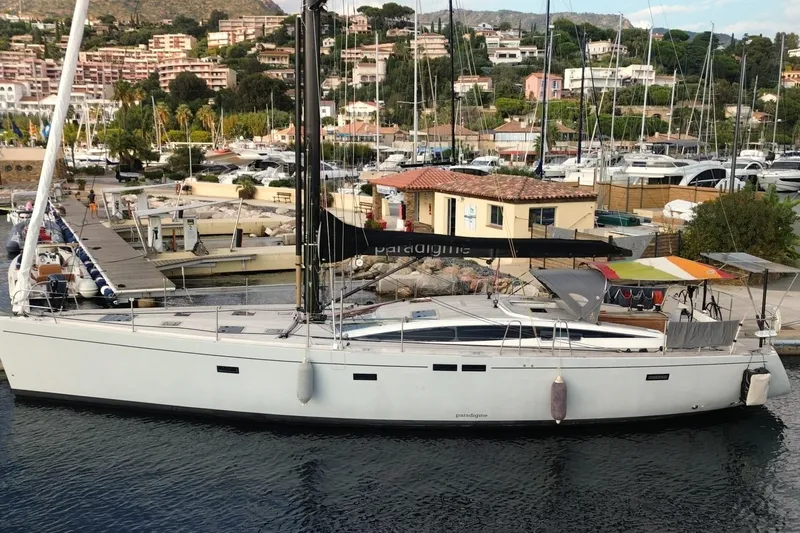 Cnb 60 Yacht Photos Pics Sailing yacht CNB BORDEAUX 60, 2013 model, docked in a marina with scenic background.