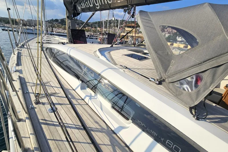 Cnb 60 Yacht Photos Pics Sleek 2013 CNB BORDEAUX 60 yacht docked at marina, showcasing elegant deck design.