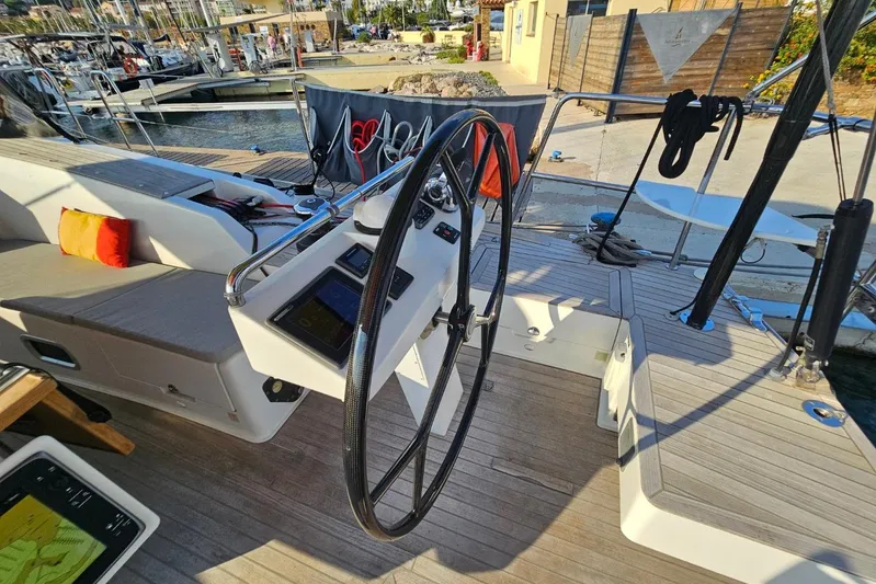 Cnb 60 Yacht Photos Pics Steering wheel and deck of 2013 CNB BORDEAUX 60 yacht at marina.