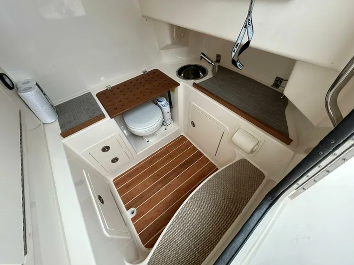  Yacht Photos Pics 2019 Grady-White 306 CANYON boat interior with toilet and sink.