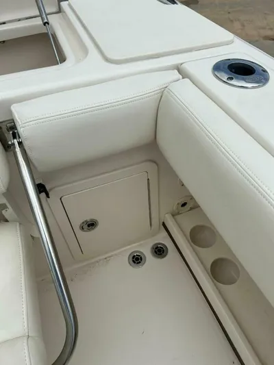  Yacht Photos Pics 2019 Grady-White 306 CANYON boat interior with white seating and storage compartments.