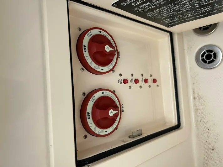  Yacht Photos Pics Control panel of a 2019 Grady-White 306 CANYON boat with red switches.