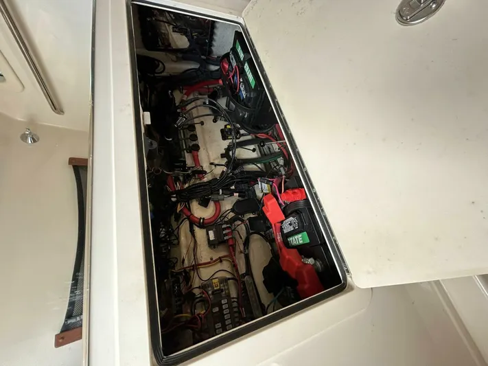  Yacht Photos Pics 2019 Grady-White 306 CANYON boat battery compartment with wiring and components.