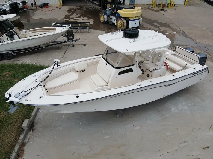  Yacht Photos Pics 2019 Grady-White 306 CANYON boat, white, docked on concrete, aerial view.