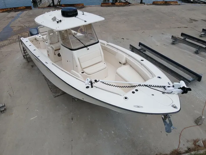  Yacht Photos Pics 2019 Grady-White 306 CANYON boat on dry dock, white exterior, spacious deck.