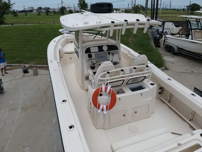  Yacht Photos Pics 2019 Grady-White 306 CANYON boat with life preserver, docked outdoors.