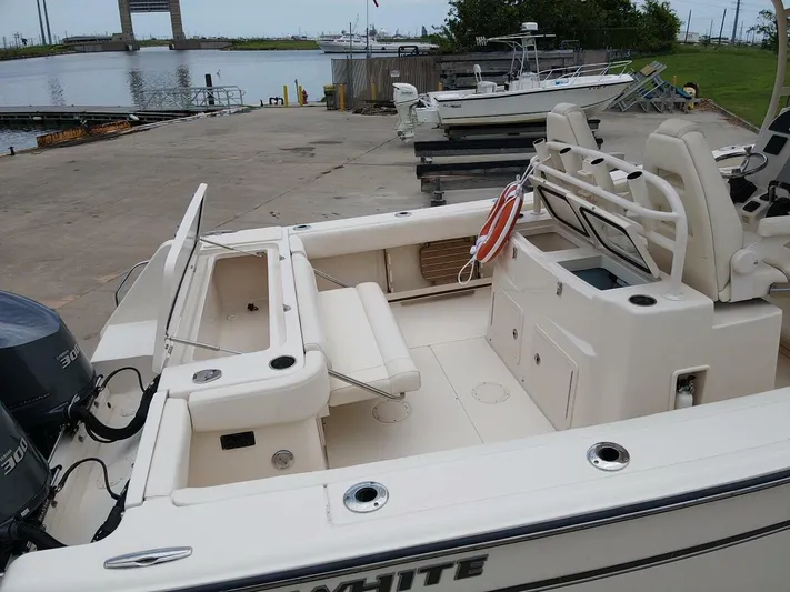  Yacht Photos Pics 2019 Grady-White 306 CANYON boat docked, featuring spacious deck and dual engines.