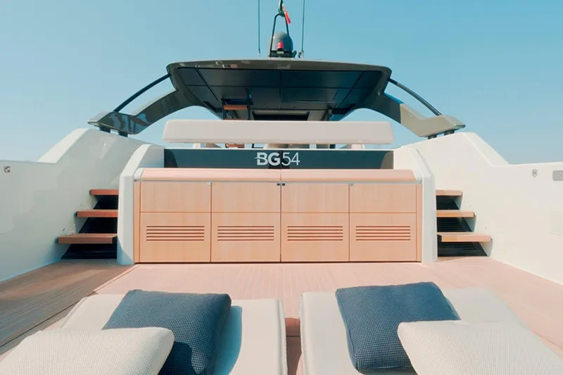 Bluegame Bg54#29 (new) Yacht Photos Pics Luxury 2025 Bluegame BG54 yacht deck with sun loungers and modern design.