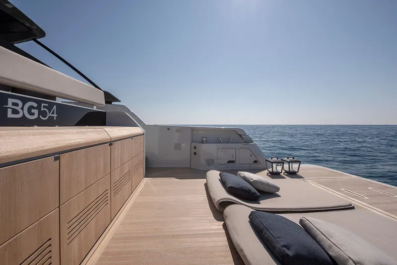Bluegame Bg54#29 (new) Yacht Photos Pics Luxurious 2025 Bluegame BG54 yacht deck with sun loungers and ocean view.