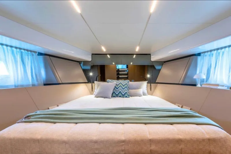 Bluegame Bg54#29 (new) Yacht Photos Pics Luxurious interior of 2025 Bluegame BG54 yacht with elegant bedding and modern lighting.