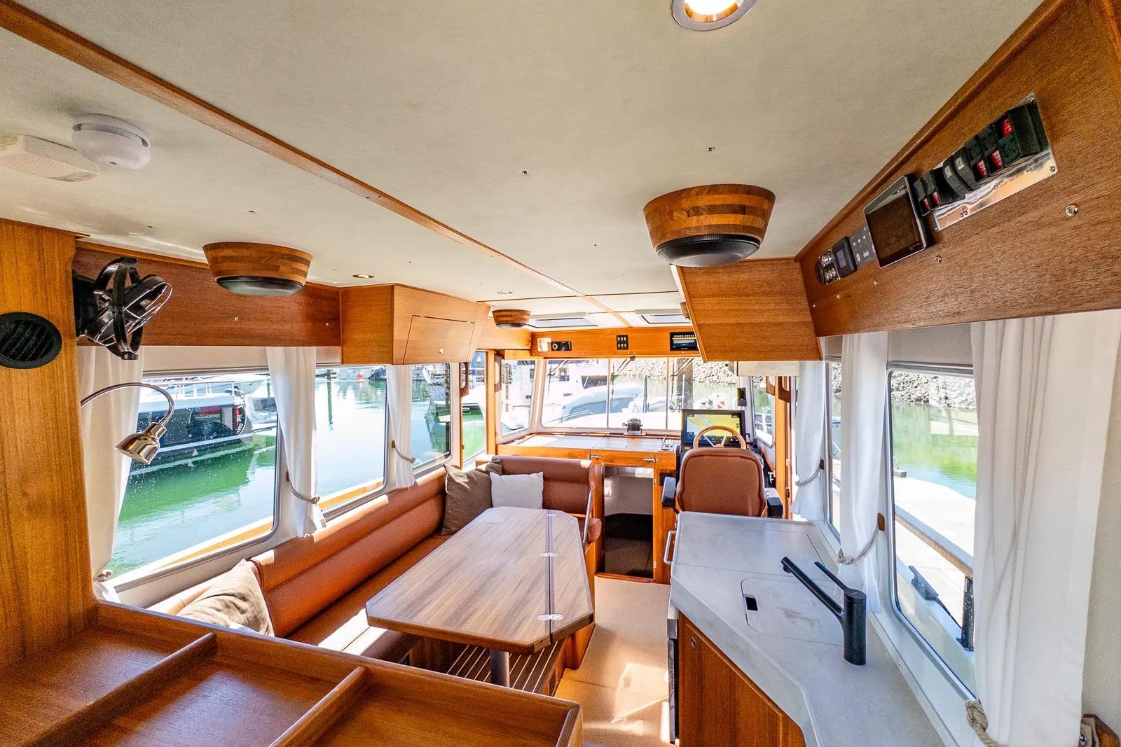 Luxurious interior of 2025 Targa 37 boat with wooden finishes and modern amenities.