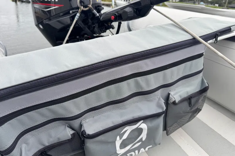  Yacht Photos Pics Storage compartment on a 2002 Silverton 352 Motor Yacht with outboard motor in background.