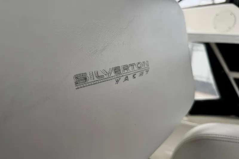  Yacht Photos Pics Close-up of Silverton 352 Motor Yacht seat, showcasing logo detail.