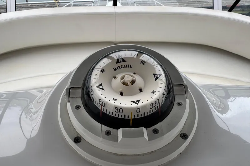  Yacht Photos Pics Compass on 2002 Silverton 352 Motor Yacht dashboard, displaying navigational directions.