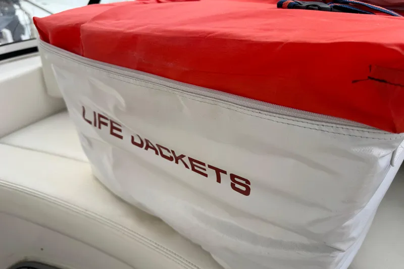  Yacht Photos Pics Life jackets stored on a 2002 Silverton 352 Motor Yacht, red and white bag.