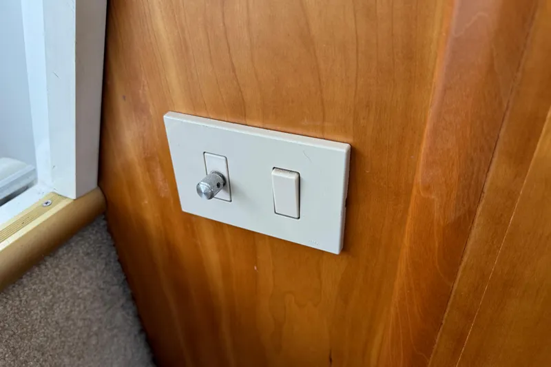  Yacht Photos Pics Light switch and dimmer on 2002 Silverton 352 Motor Yacht wooden panel.