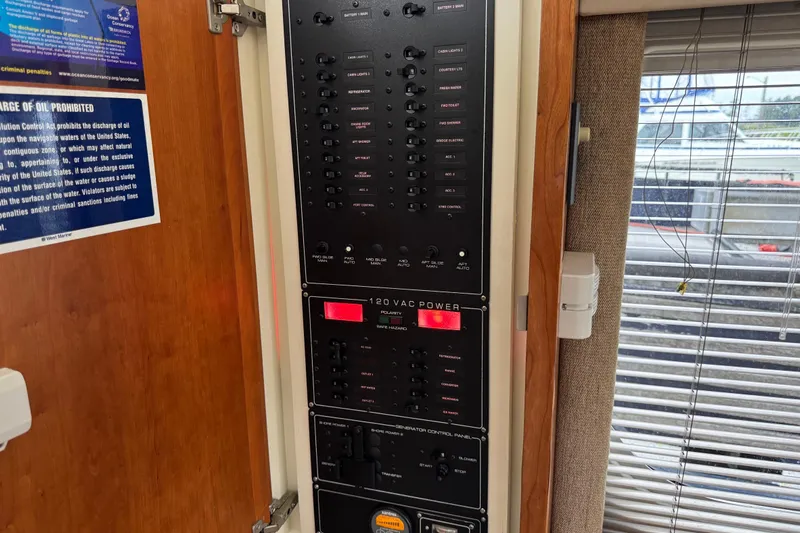  Yacht Photos Pics Electrical control panel inside a 2002 Silverton 352 Motor Yacht, featuring various switches and indicators.