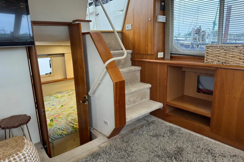  Yacht Photos Pics Interior of 2002 Silverton 352 Motor Yacht with stairs, bedroom, and window view.