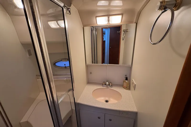  Yacht Photos Pics Bathroom interior of 2002 Silverton 352 Motor Yacht with sink and shower.