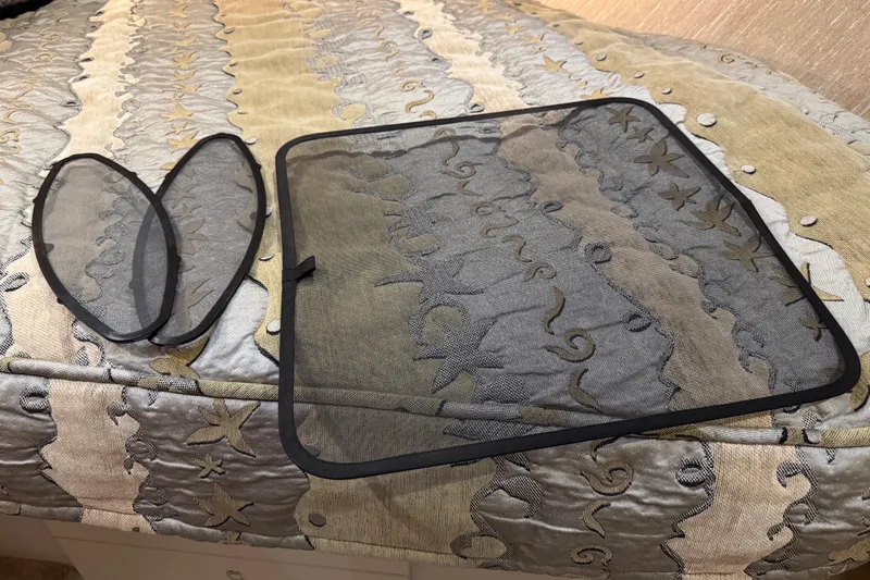  Yacht Photos Pics Mesh screens on patterned fabric inside a 2002 Silverton 352 Motor Yacht.