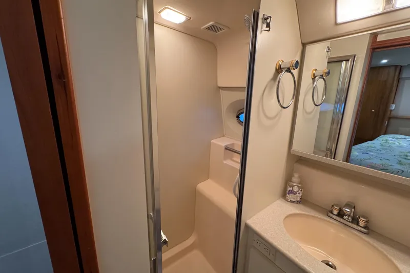  Yacht Photos Pics Bathroom interior of 2002 Silverton 352 Motor Yacht with shower and sink.
