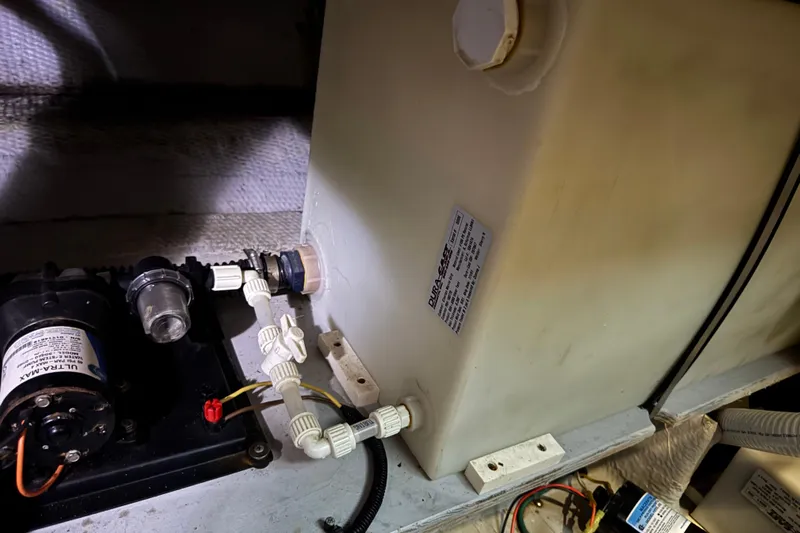  Yacht Photos Pics 2002 Silverton 352 Motor Yacht engine room with water tank and pump system.