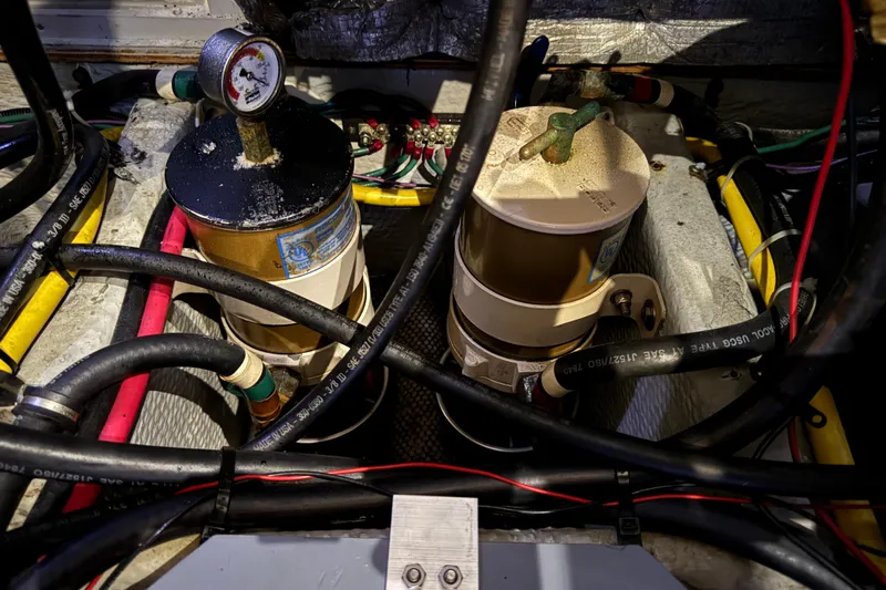  Yacht Photos Pics Engine compartment of a 2002 Silverton 352 Motor Yacht with fuel filters and hoses.