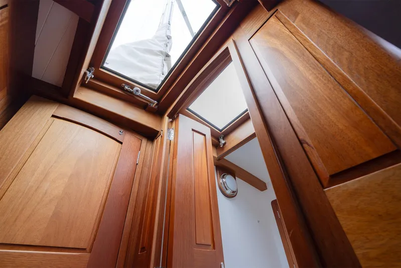  Yacht Photos Pics Interior view of 2011 Spirit 50 DH yacht with wooden finish and skylight.