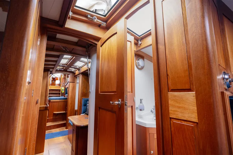  Yacht Photos Pics Luxurious wooden interior of 2011 Spirit 50 DH yacht, featuring elegant cabinetry and skylights.