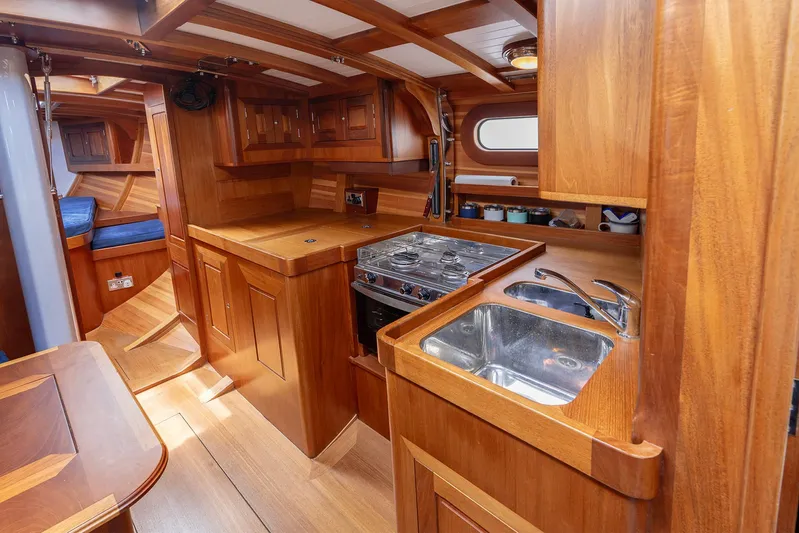  Yacht Photos Pics Luxurious wooden interior of 2011 Spirit 50 DH yacht kitchen with stove and sink.