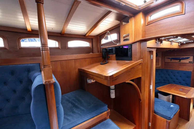  Yacht Photos Pics Luxurious 2011 Spirit 50 DH yacht interior with elegant wood finish and plush blue seating.