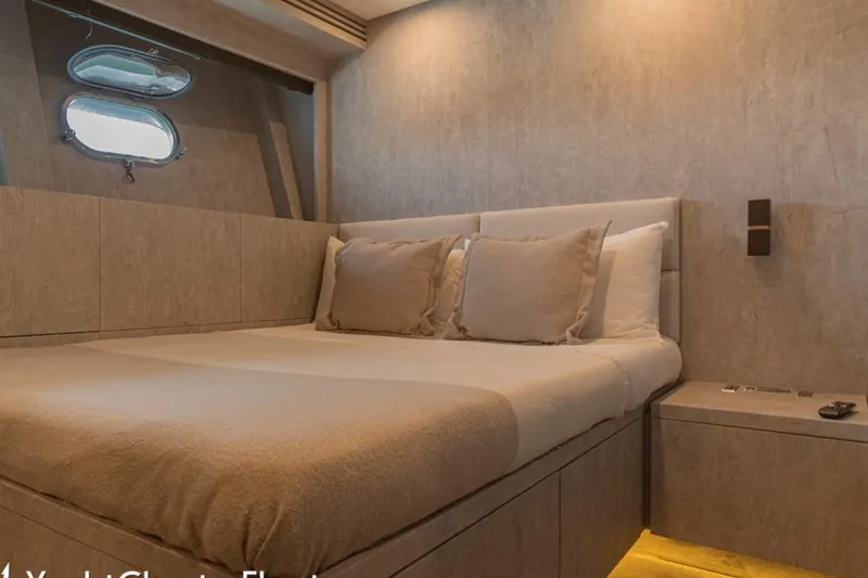 La Romana Yacht Photos Pics Luxurious bedroom interior on 2006 Cantiere Arno Leopard 31 yacht, featuring elegant design.